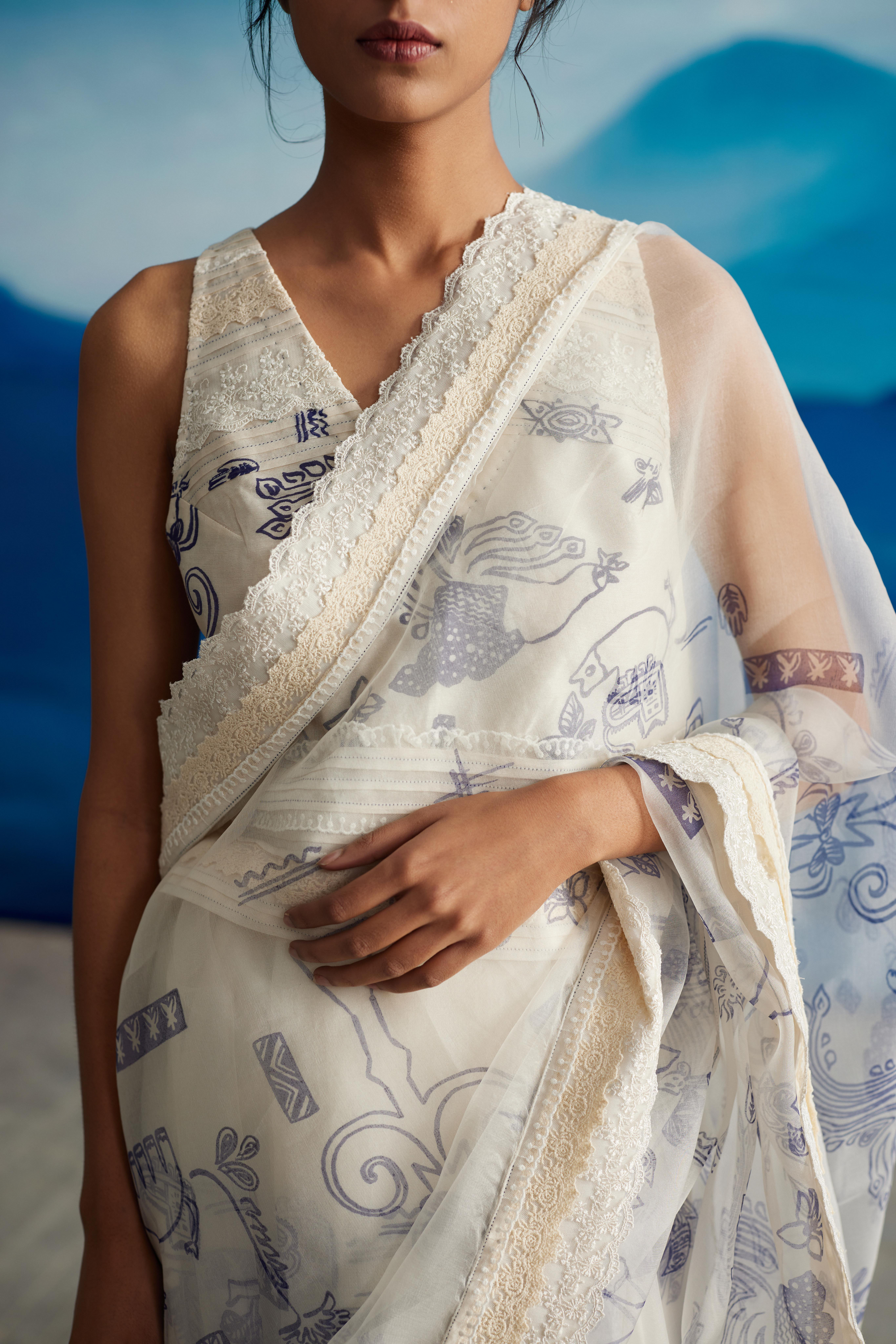 White Silk Oganza Saree With Tassels at Kamakhyaa by Ahmev. This item is Casual Wear, Indian Formals, Indigo Eden by Ahmev, Lace, Natural, Organza, Prints, Regular Fit, Sarees, White, Womenswear