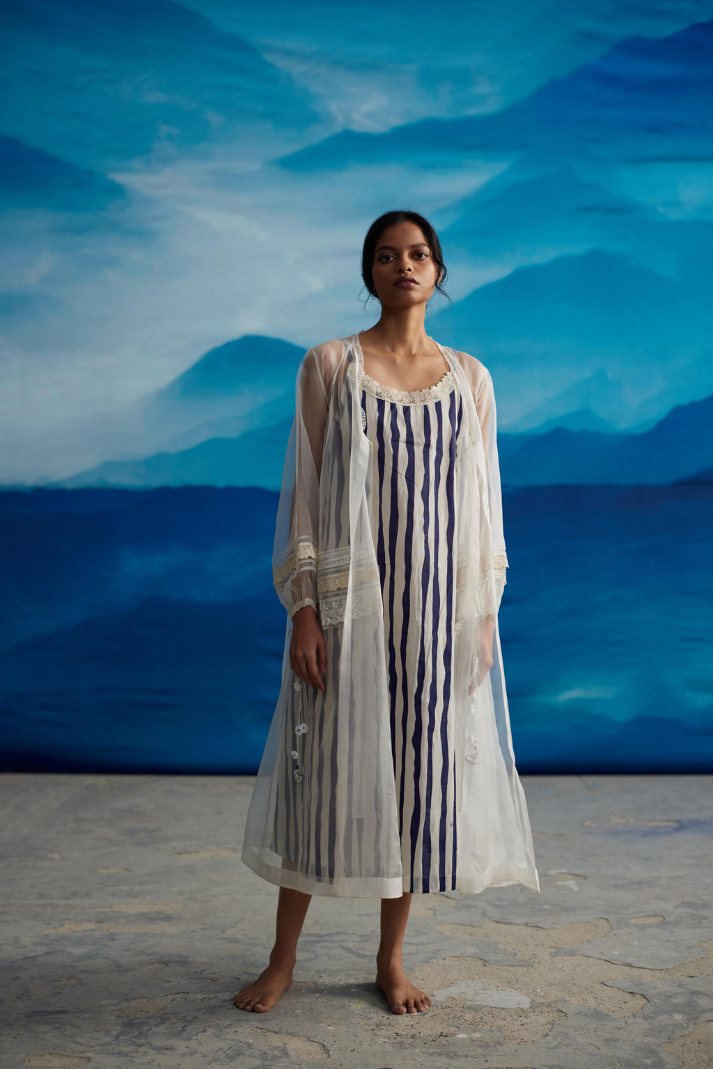 White Striped Tie-Up Midi Dress at Kamakhyaa by Ahmev. This item is Casual Wear, Indigo Eden by Ahmev, Korean Chic, Lace, Midi Dresses, Natural, Organza, Regular Fit, Stripes, White, Womenswear