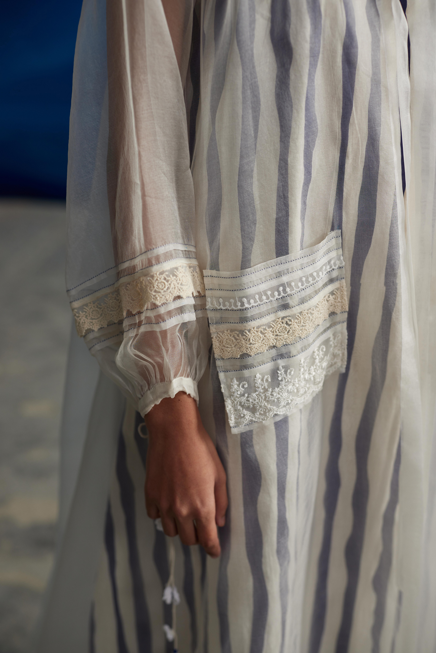 White Striped Tie-Up Midi Dress at Kamakhyaa by Ahmev. This item is Casual Wear, Indigo Eden by Ahmev, Korean Chic, Lace, Midi Dresses, Natural, Organza, Regular Fit, Stripes, White, Womenswear