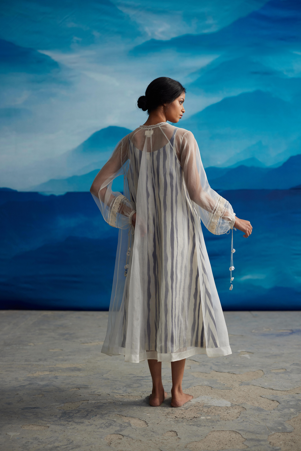 White Striped Tie-Up Midi Dress at Kamakhyaa by Ahmev. This item is Casual Wear, Indigo Eden by Ahmev, Korean Chic, Lace, Midi Dresses, Natural, Organza, Regular Fit, Stripes, White, Womenswear