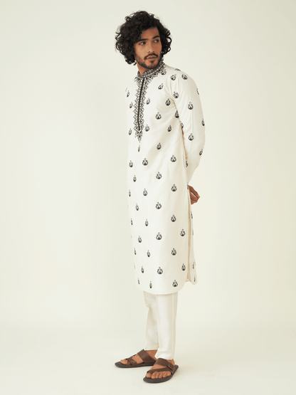 White Viscose Silk Kurta Set at Kamakhyaa by RoohbyRidhimaa. This item is Festive Wear, Kurta Pant Sets, Men Kurta Pant Sets, Menswear By RoohbyRidhimaa, Qala By RoohbyRidhimaa, Regular Fit, Solids, Viscose Raw Silk, White