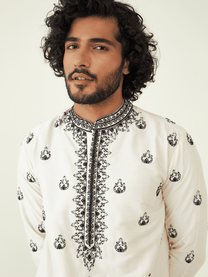 White Viscose Silk Kurta Set at Kamakhyaa by RoohbyRidhimaa. This item is Festive Wear, Kurta Pant Sets, Men Kurta Pant Sets, Menswear By RoohbyRidhimaa, Qala By RoohbyRidhimaa, Regular Fit, Solids, Viscose Raw Silk, White