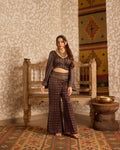 Wrap top with flared pant set at Kamakhyaa by Akashi Clothing. This item is Ajrakh by Akashi Clothing, Under $200