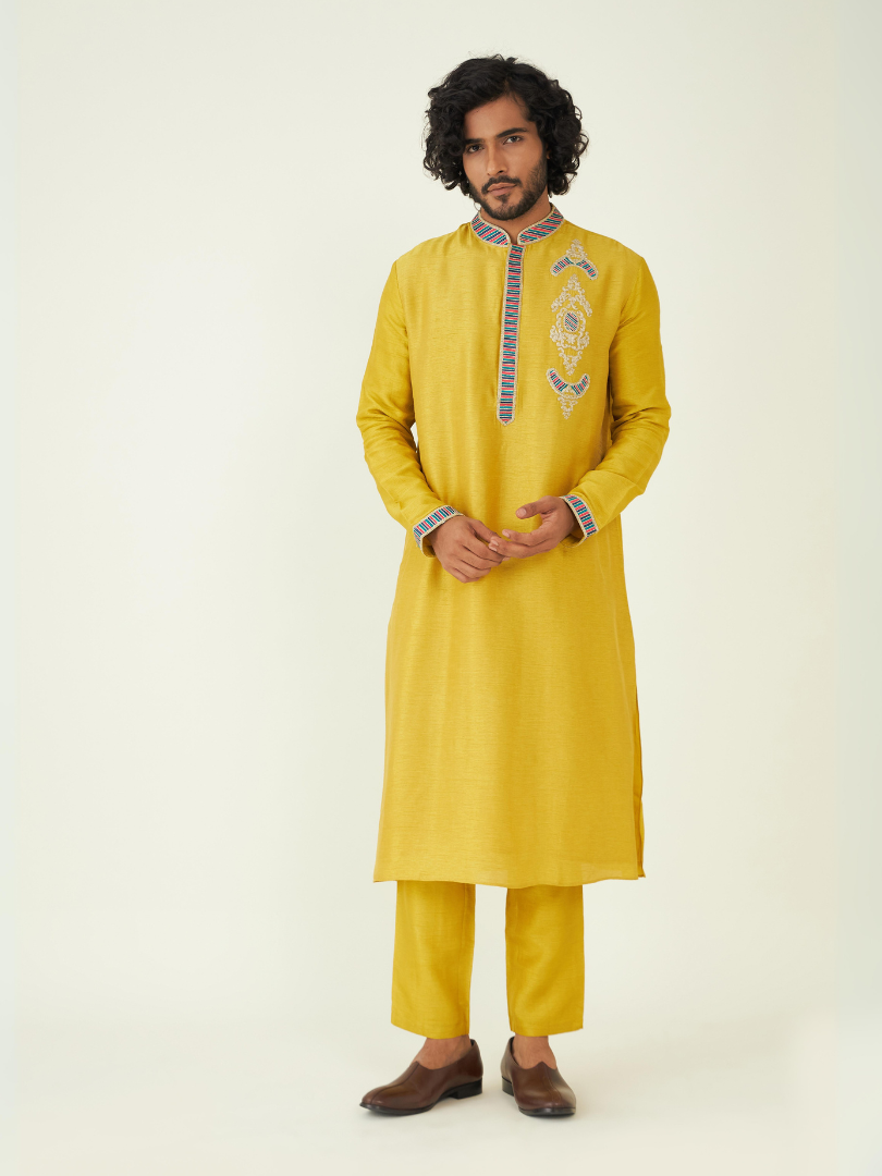 Yellow Regular Fit Kurta Set at Kamakhyaa by RoohbyRidhimaa. This item is Festive Wear, Kurta Pant Sets, Men Kurta Pant Sets, Menswear By RoohbyRidhimaa, Qala By RoohbyRidhimaa, Regular Fit, Solids, Viscose Raw Silk, Yellow