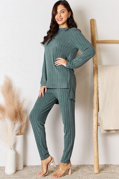 Basic Bae Full Size Ribbed Round Neck High-Low Slit Top and Pants Set at Kamakhyaa by Trendsi. This item is Basic Bae, Ship from USA, Trendsi, Womenswear