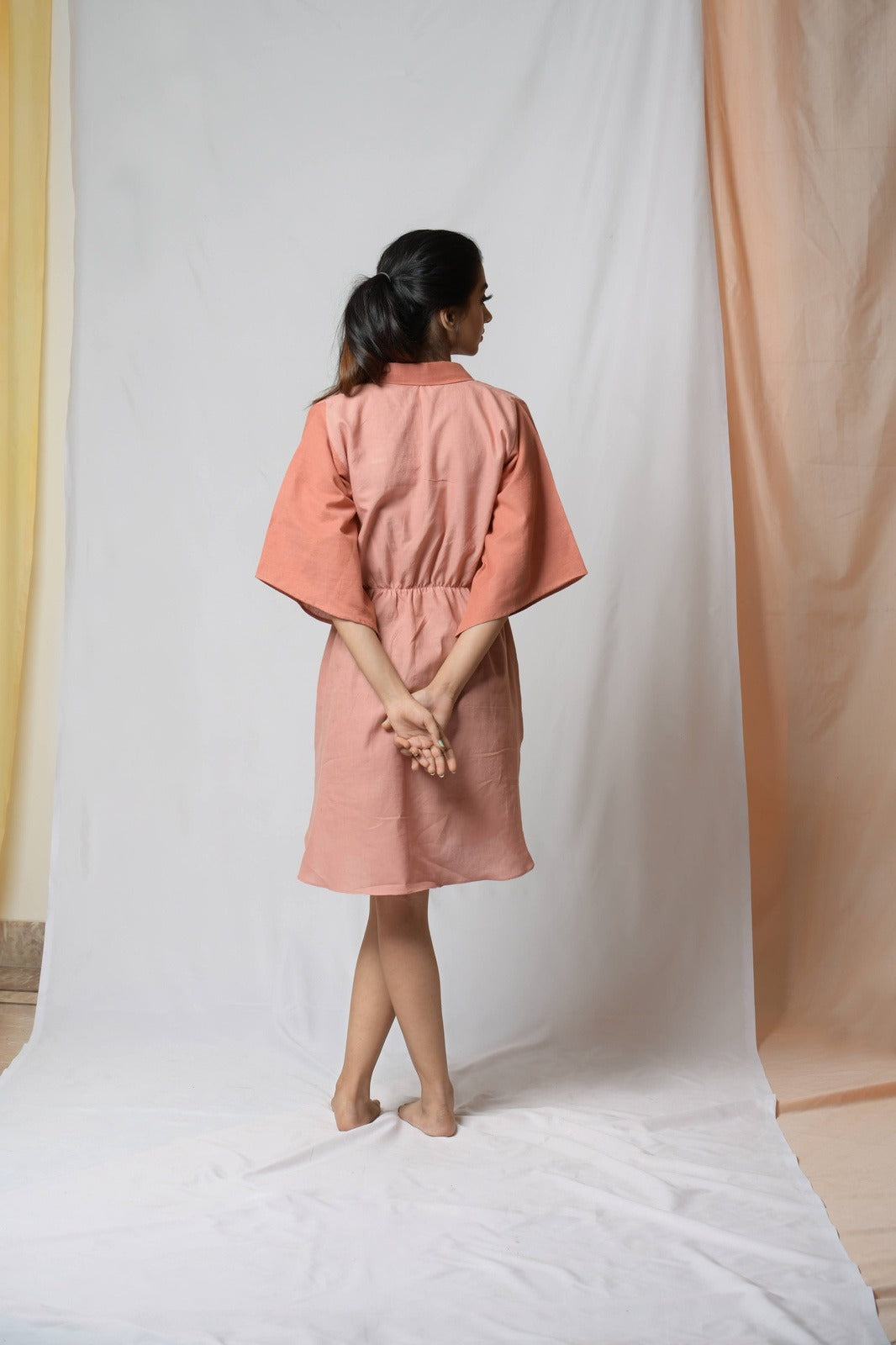 Battle To Breathe Peach Midi Dress at Kamakhyaa by Niraa. This item is Casual Wear, Cotton khadi, Mini Dresses, Natural with azo dyes, Peach, Regular Fit, Shirt Dresses, Solids, Tales of rippling brooks, Womenswear