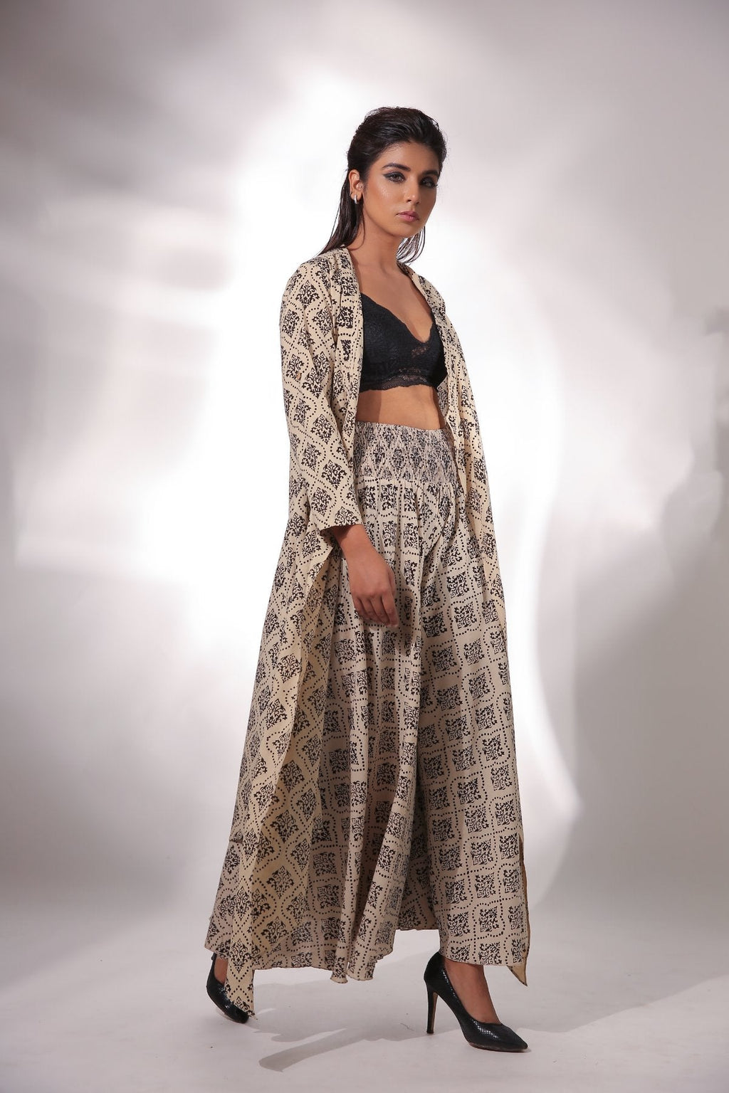 Beige Block Printed Cape With Pants at Kamakhyaa by Keva. This item is Beige, Black, Block Prints, Cape, Co-ord Sets, Cotton, Natural, Office, Office Wear Co-ords, Printed Selfsame, Relaxed Fit, Resort Wear, Womenswear, Zima