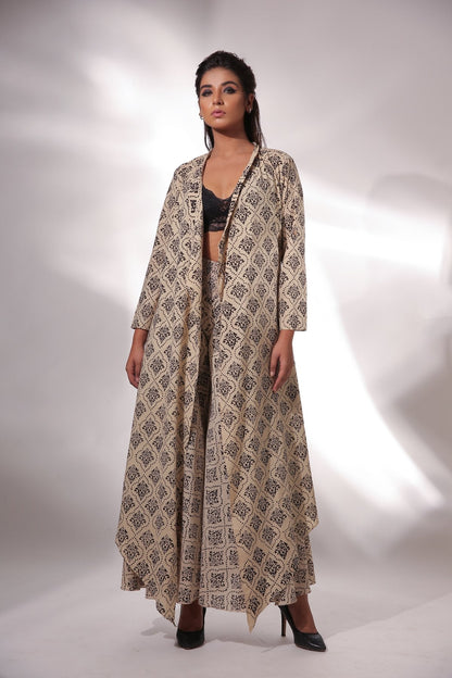 Beige Block Printed Cape With Pants at Kamakhyaa by Keva. This item is Beige, Black, Block Prints, Cape, Co-ord Sets, Cotton, Natural, Office, Office Wear Co-ords, Printed Selfsame, Relaxed Fit, Resort Wear, Womenswear, Zima