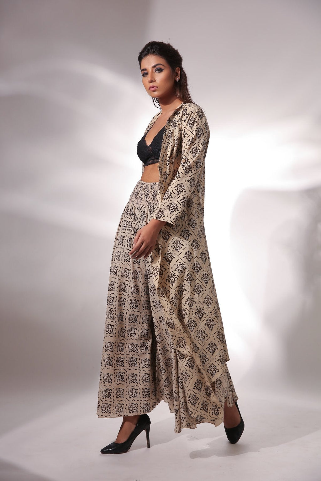 Beige Block Printed Cape With Pants at Kamakhyaa by Keva. This item is Beige, Black, Block Prints, Cape, Co-ord Sets, Cotton, Natural, Office, Office Wear Co-ords, Printed Selfsame, Relaxed Fit, Resort Wear, Womenswear, Zima