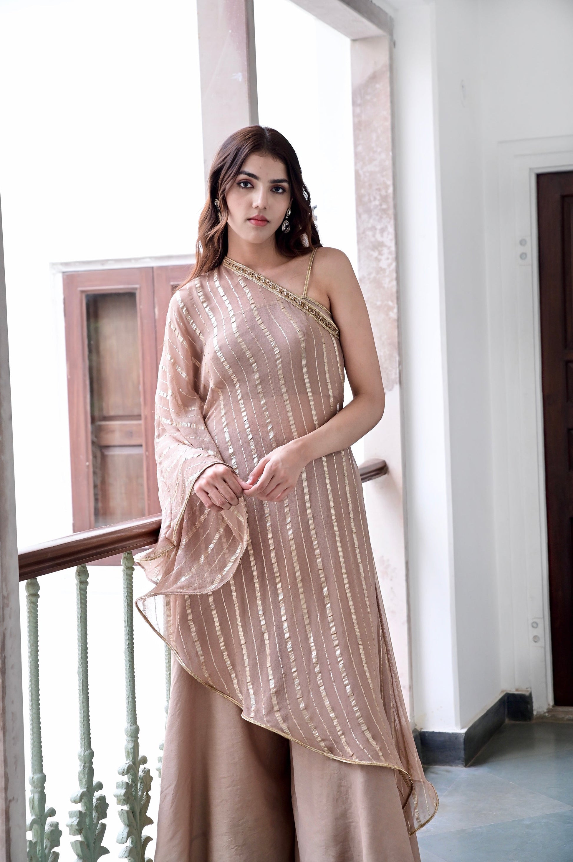 Beige One Shoulder Co-ord Set at Kamakhyaa by Taro. This item is Beige, Chaandi, Co-ord Sets, Cotton, Cotton Lurex, Natural, One Shoulder, Partywear Co-ords, Regular Fit, Solids, Womenswear