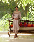 Beige Satin Silk Kurta Pant Set at Kamakhyaa by Mayura Kumar. This item is Beige, Casual Wear, Festive Wear, Kurta Pant Sets, Mayura Kumar, Regular Fit, Satin, Silk, Solids, Timeless Elegance, Womenswear