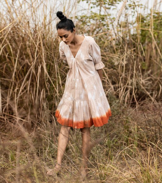 Beige shibori dyed ikkat Mini Dress at Kamakhyaa by Khara Kapas. This item is Beige, Cotton, Handwoven, Ikat Print, Lost & Found, Natural, Ombre & Dyes, Regular Fit, Resort Wear, Tiered Dresses, Womenswear