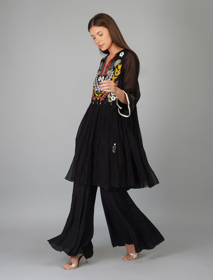 Black Chanderi Hand Embroidered Tiered Tunic Set at Kamakhyaa by Devyani Mehrotra. This item is Black, Chanderi Silk, Co-ord Sets, Embroidered, Evening Wear, Georgette, Natural, Pre Spring 2023, Relaxed Fit, Solids, Vacation Co-ords, Viscose, Womenswear