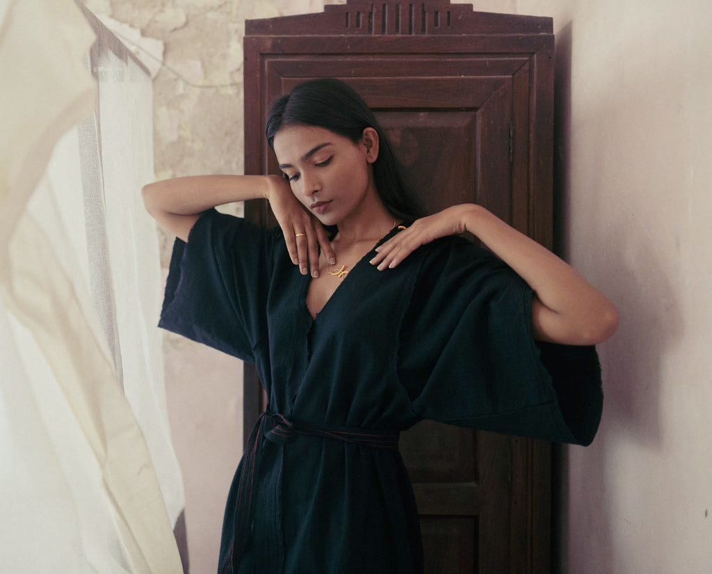 Black Cotton Dress at Kamakhyaa by Deeta Clothing. This item is Black, Casual Wear, Handwoven Cotton, Kaftan Dresses, Kaftans, Maxi Dresses, Natural with azo dyes, Relaxed Fit, Shibui AW22, Solids, Womenswear