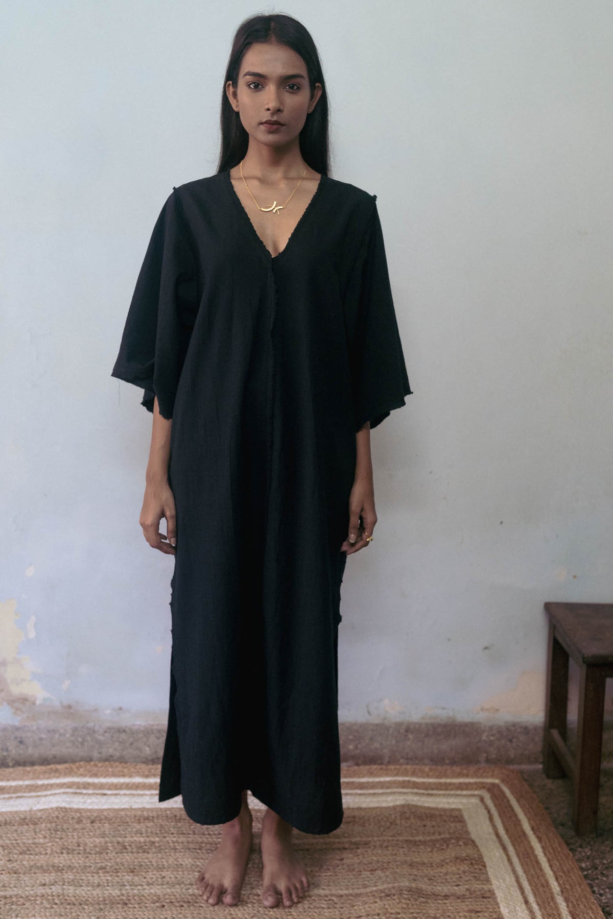 Black Cotton Dress at Kamakhyaa by Deeta Clothing. This item is Black, Casual Wear, Handwoven Cotton, Kaftan Dresses, Kaftans, Maxi Dresses, Natural with azo dyes, Relaxed Fit, Shibui AW22, Solids, Womenswear