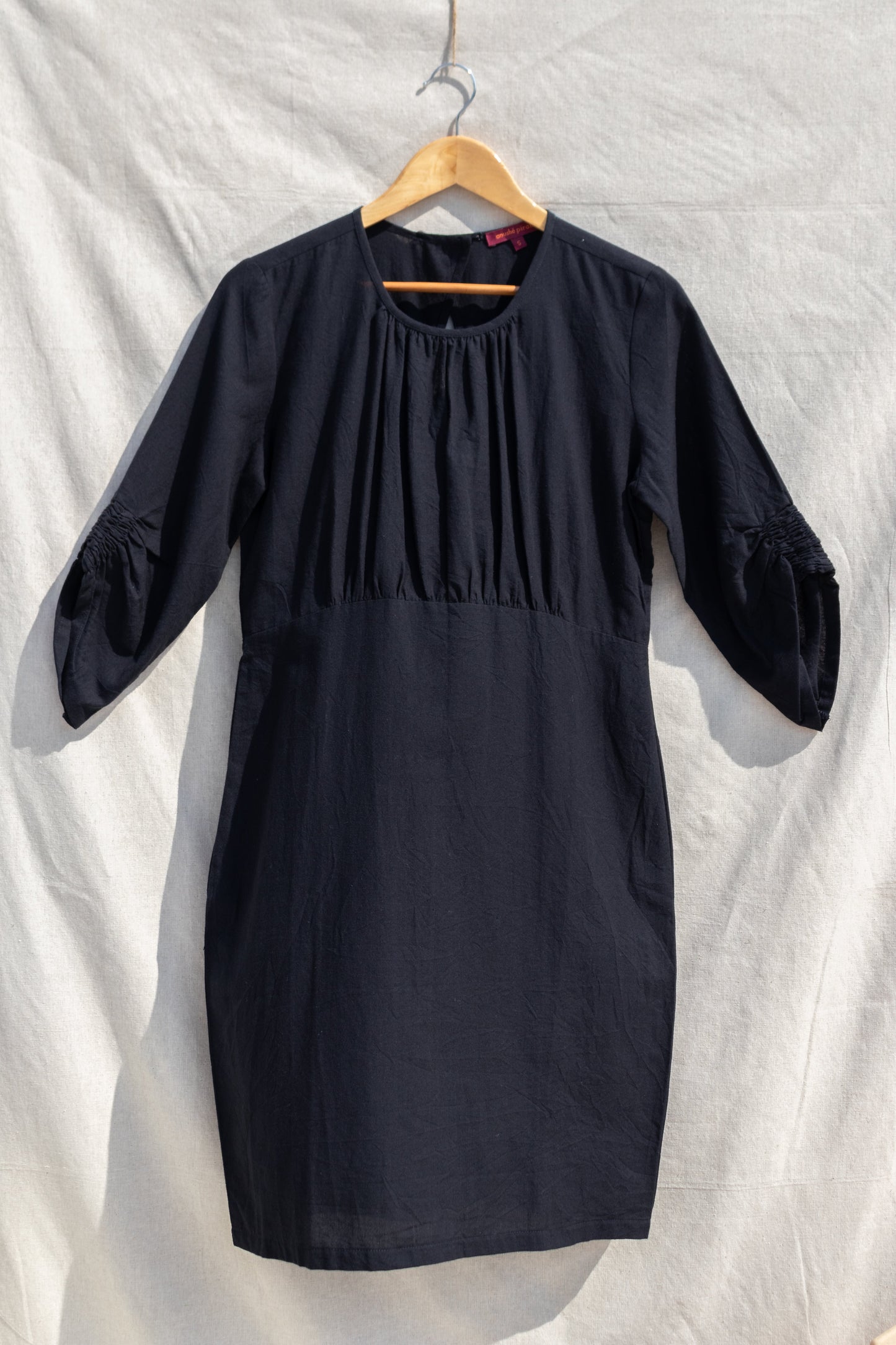 Black Midi Dress at Kamakhyaa by Anushé Pirani. This item is Black, Handwoven Cotton, July Sale, July Sale 2023, Midi Dresses, Natural, Office Wear, Regular Fit, sale anushe pirani, Short Dresses, Solids, The Line Tales, Womenswear