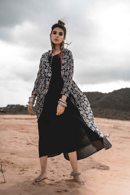 Black Rayon Dress With Cotton Block Printed Asymmetric Cape - Set Of 2 at Kamakhyaa by Keva. This item is Black, Block Prints, Cape, Co-ord Sets, Cotton, Dress Sets, For Mother, For Mother W, Jackets, Midi Dresses, Natural, Relaxed Fit, Resort Wear, Wild Child, Womenswear