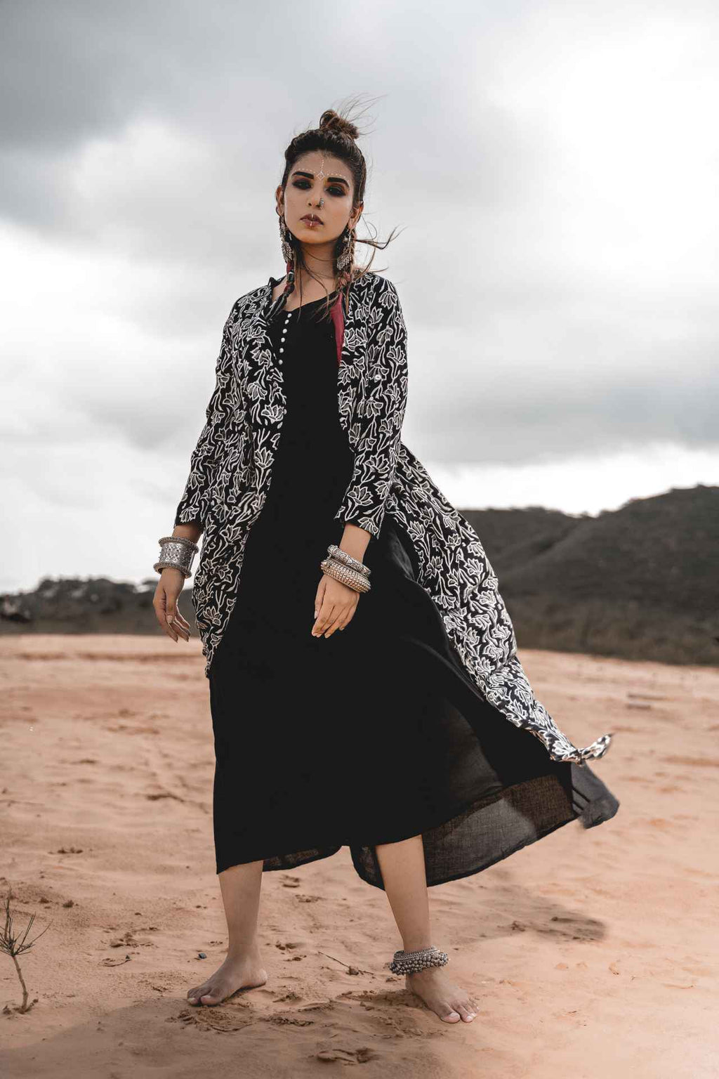 Black Rayon Dress With Cotton Block Printed Asymmetric Cape - Set Of 2 at Kamakhyaa by Keva. This item is Black, Block Prints, Cape, Co-ord Sets, Cotton, Dress Sets, For Mother, For Mother W, Jackets, Midi Dresses, Natural, Relaxed Fit, Resort Wear, Wild Child, Womenswear
