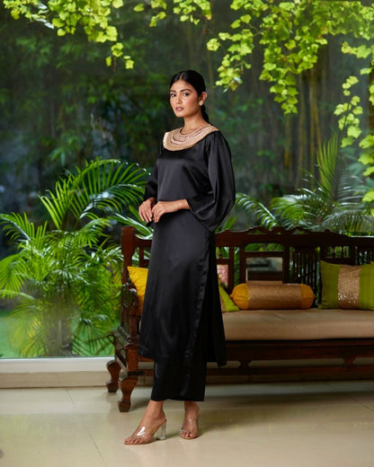 Black Satin Silk Kurta Pant Set at Kamakhyaa by Mayura Kumar. This item is Black, Casual Wear, Festive Wear, Kurta Pant Sets, Mayura Kumar, Regular Fit, Satin, Silk, Solids, Timeless Elegance, Womenswear