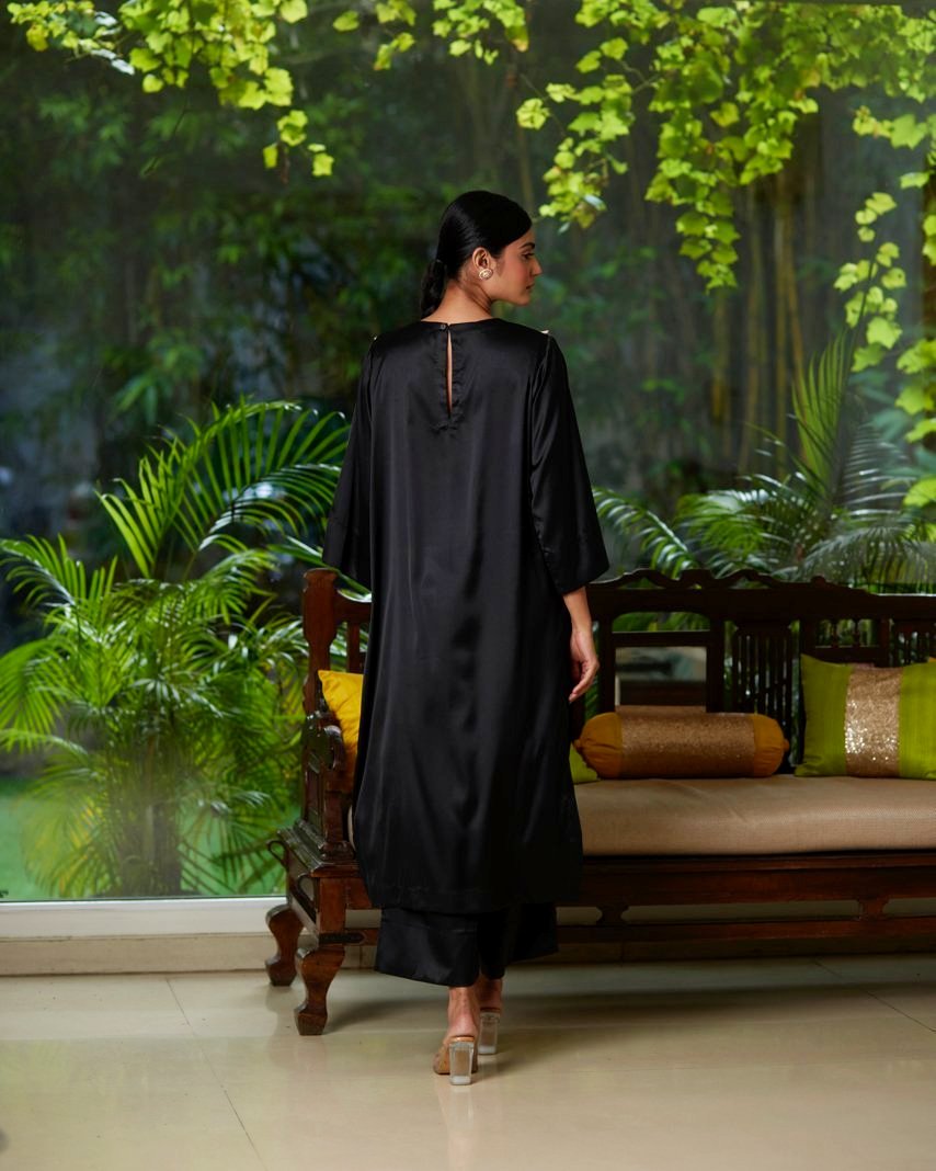 Black Satin Silk Kurta Pant Set at Kamakhyaa by Mayura Kumar. This item is Black, Casual Wear, Festive Wear, Kurta Pant Sets, Mayura Kumar, Regular Fit, Satin, Silk, Solids, Timeless Elegance, Womenswear