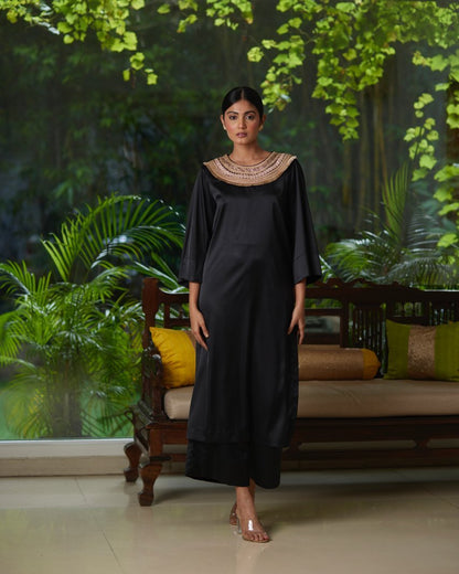 Black Satin Silk Kurta Pant Set at Kamakhyaa by Mayura Kumar. This item is Black, Casual Wear, Festive Wear, Kurta Pant Sets, Mayura Kumar, Regular Fit, Satin, Silk, Solids, Timeless Elegance, Womenswear