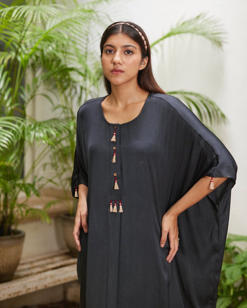 Black Silk Kaftan With Golden Border at Kamakhyaa by Mayura Kumar. This item is Ajrakh Heritage, Black, Casual Wear, Dresses, Festive Wear, Kaftans, Mayura Kumar, Modal Silk, Relaxed Fit, Solids, Womenswear