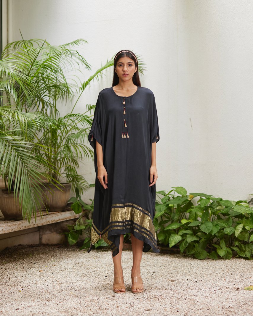 Black Silk Kaftan With Golden Border at Kamakhyaa by Mayura Kumar. This item is Ajrakh Heritage, Black, Casual Wear, Dresses, Festive Wear, Kaftans, Mayura Kumar, Modal Silk, Relaxed Fit, Solids, Womenswear