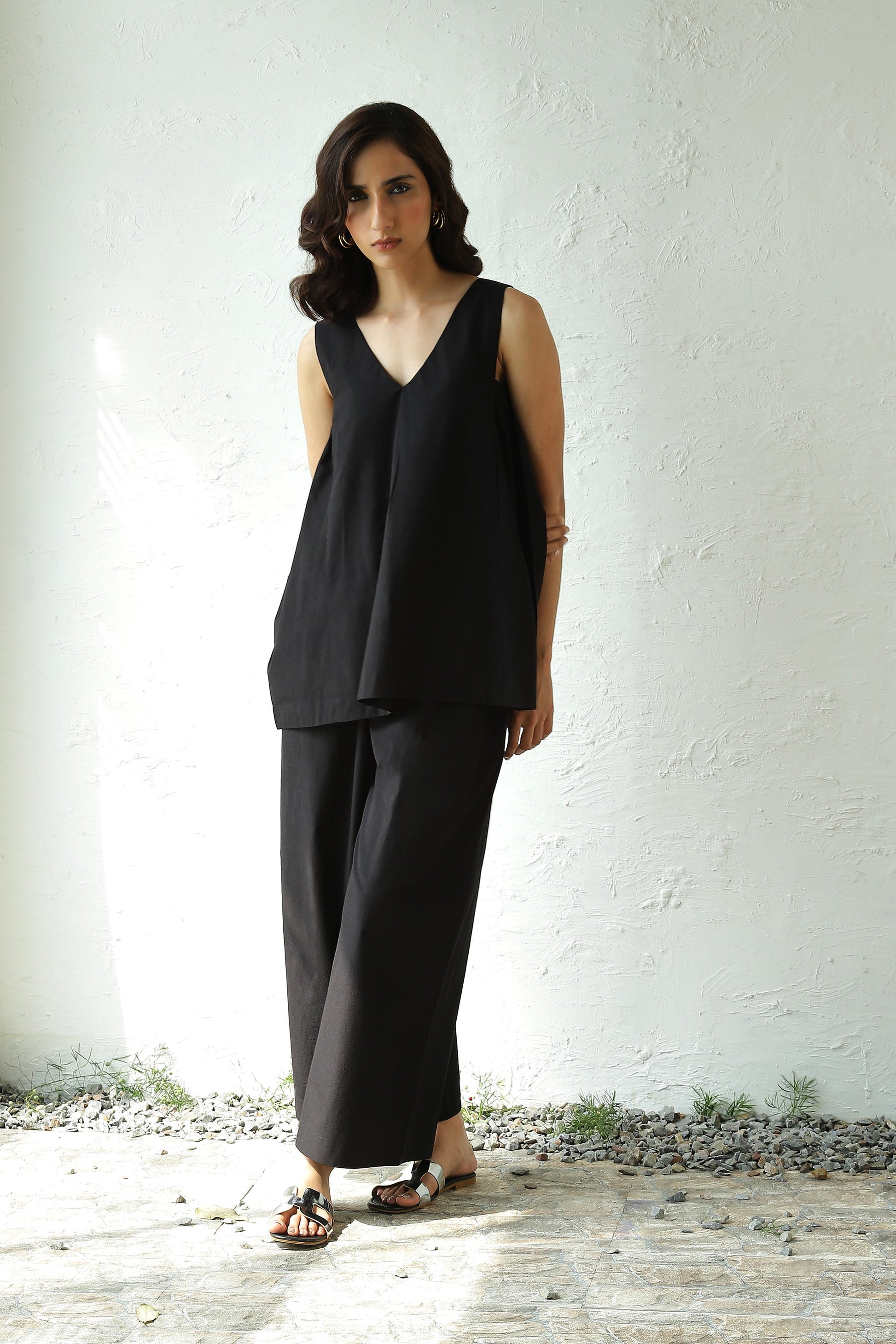 Black Sleeveless V Neck Top With Black Flared Pant Set at Kamakhyaa by Canoopi. This item is Black, Canoopi, Casual Wear, Complete Sets, Natural, Poplin, Regular Fit, Solids, Vacation Co-ords, Womenswear