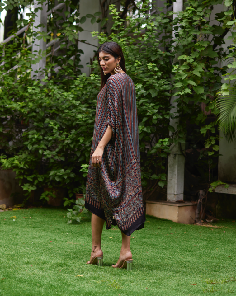 Black Striped Silk Kaftan at Kamakhyaa by Mayura Kumar. This item is Ajrakh Heritage, Black, Casual Wear, Dresses, Festive Wear, Kaftans, Mayura Kumar, Modal Silk, Prints, Relaxed Fit, Silk, Womenswear