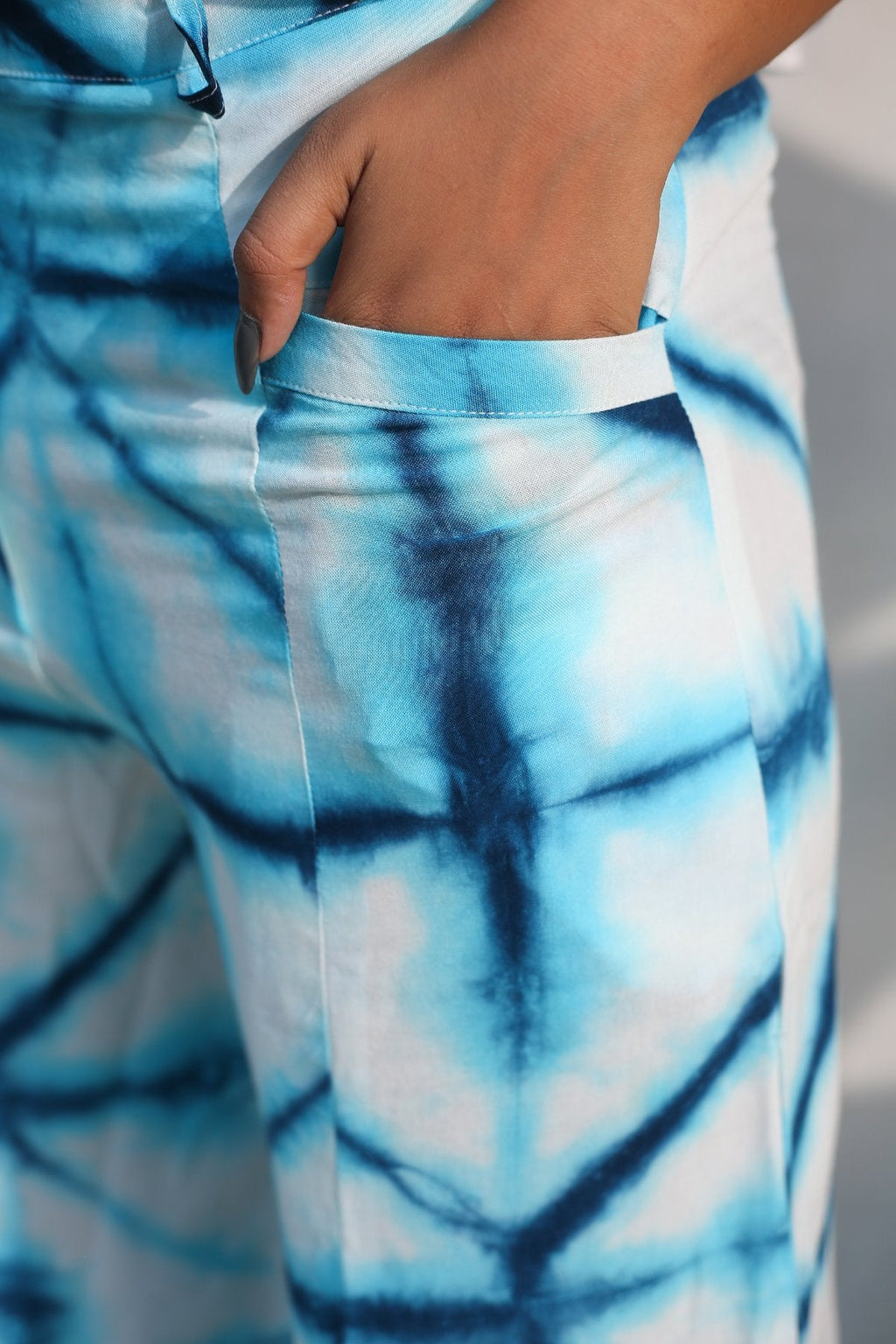 Blue And White Bell Bottom Pants at Kamakhyaa by Keva. This item is Blue, Day Dream, Natural, Palazzo Pants, Rayon, Relaxed Fit, Resort Wear, Tie & Dye, Womenswear