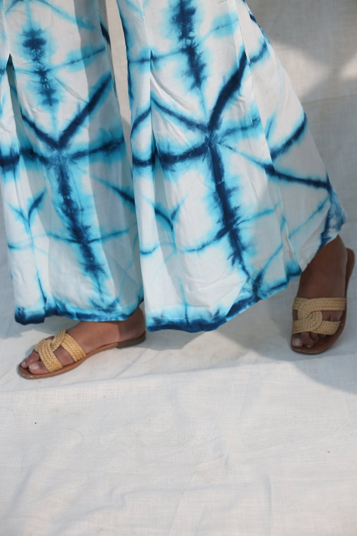 Blue And White Bell Bottom Pants at Kamakhyaa by Keva. This item is Blue, Day Dream, Natural, Palazzo Pants, Rayon, Relaxed Fit, Resort Wear, Tie & Dye, Womenswear