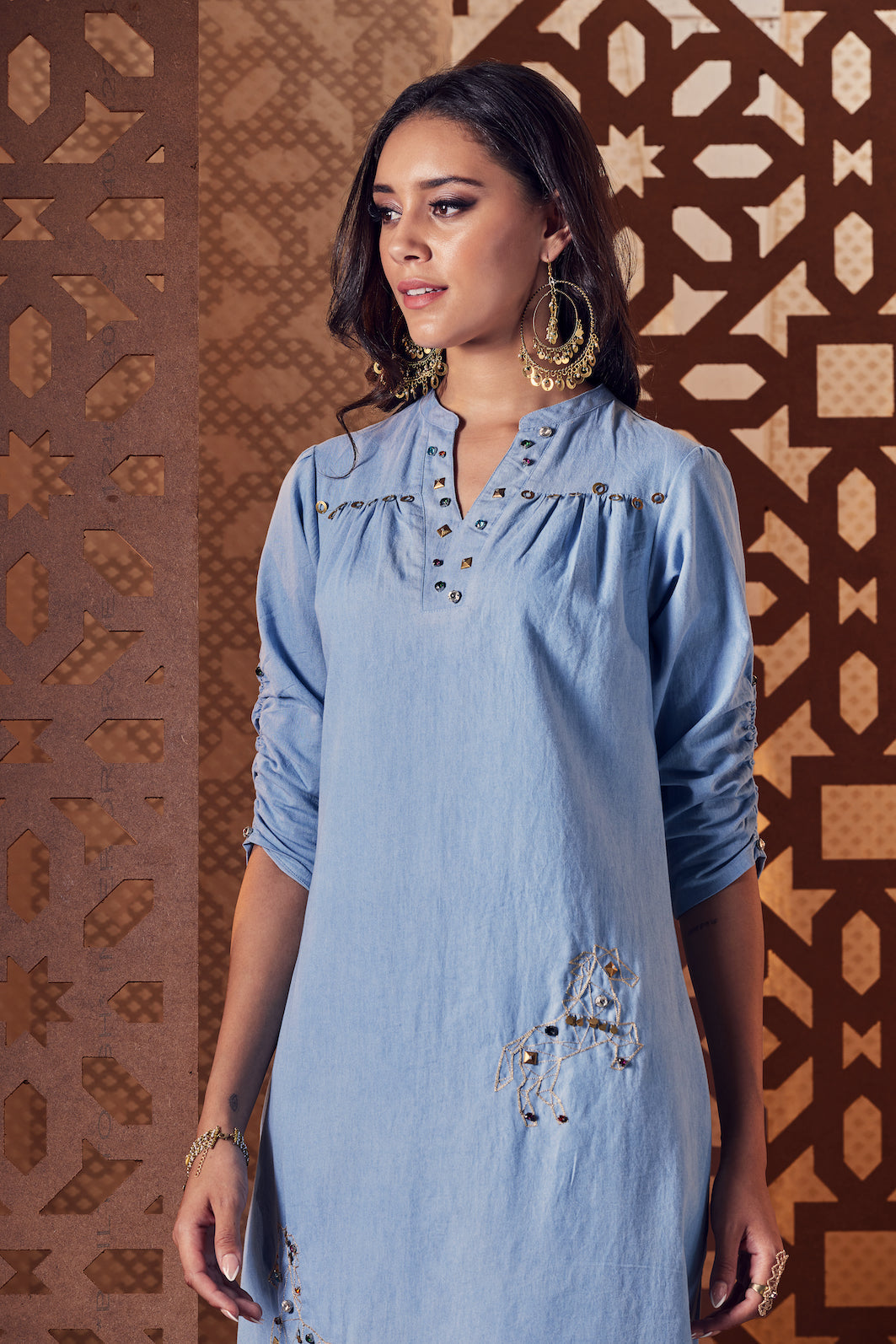 Blue Denim A-Line Side Slit Dress at Kamakhyaa by Charkhee. This item is Blue, Denim, Embroidered, Ethnic Wear, Midi Dresses, Naayaab, Natural, Nayaab, Relaxed Fit, Womenswear