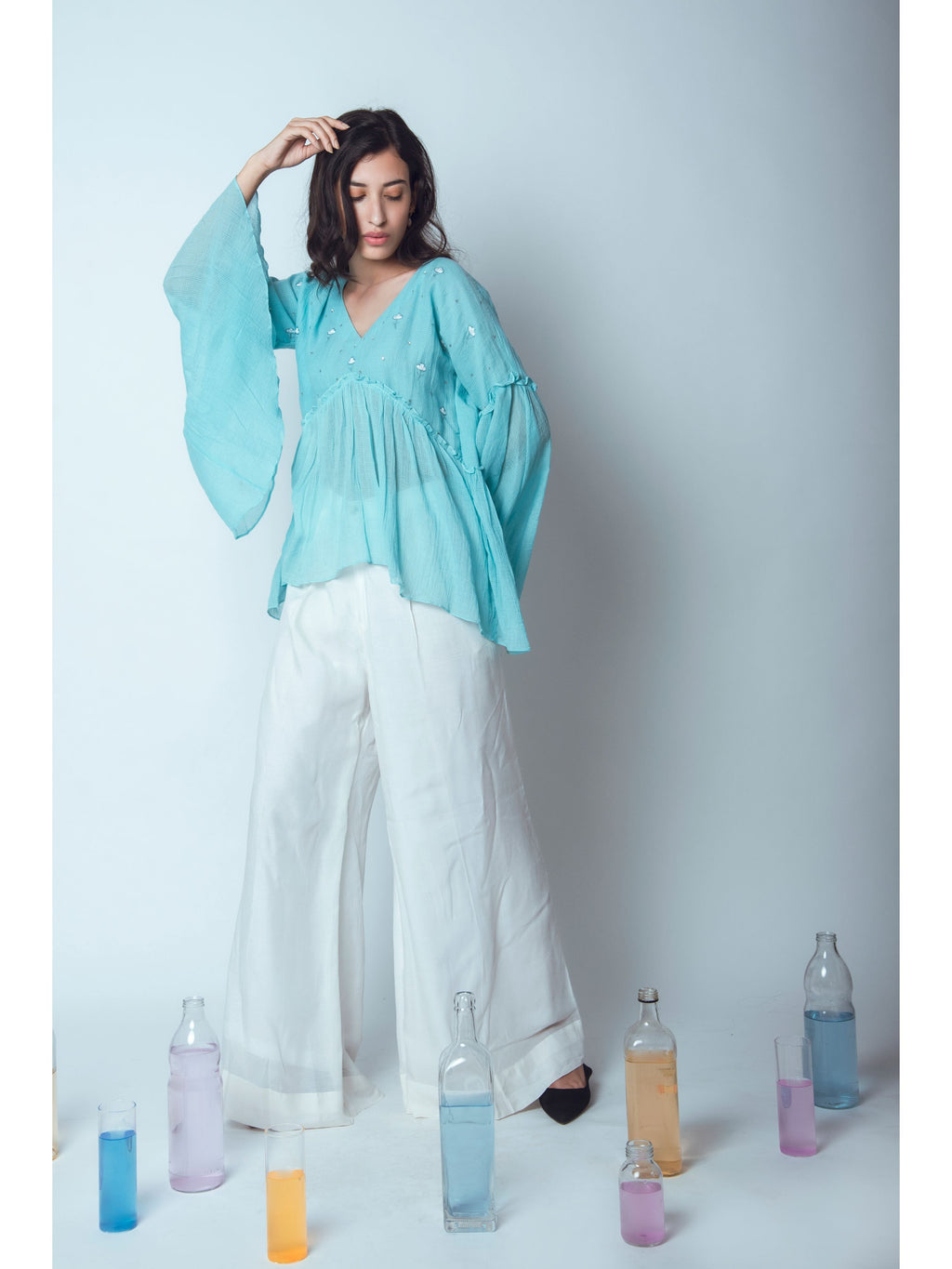 Blue Embroidered Tunic Top at Kamakhyaa by The Loom Art. This item is Blouses, Blue, Euphoria, July Sale, July Sale 2023, kota Slub, Natural, Party Wear, Regular Fit, Tops, Womenswear