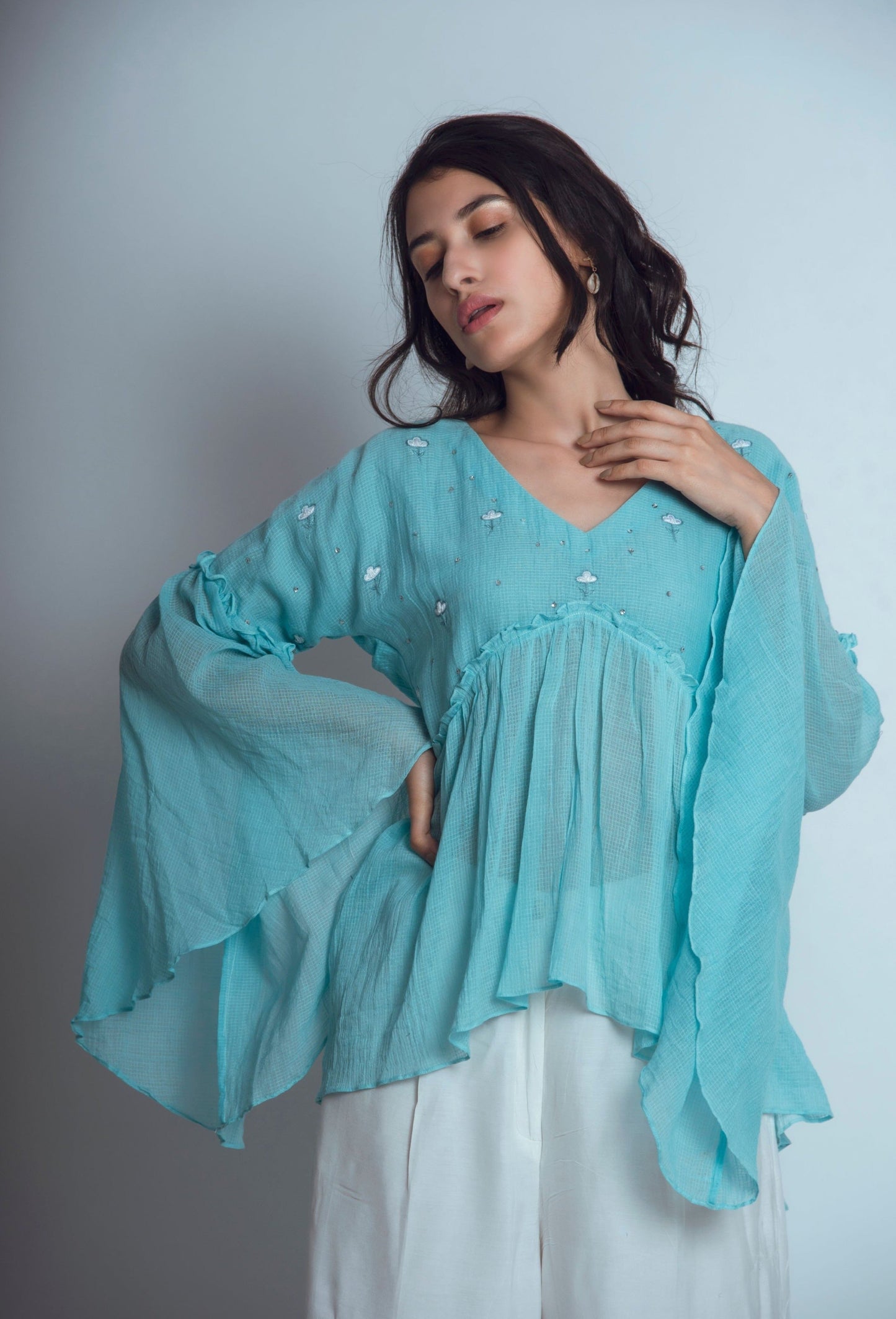 Blue Embroidered Tunic Top at Kamakhyaa by The Loom Art. This item is Blouses, Blue, Euphoria, July Sale, July Sale 2023, kota Slub, Natural, Party Wear, Regular Fit, Tops, Womenswear