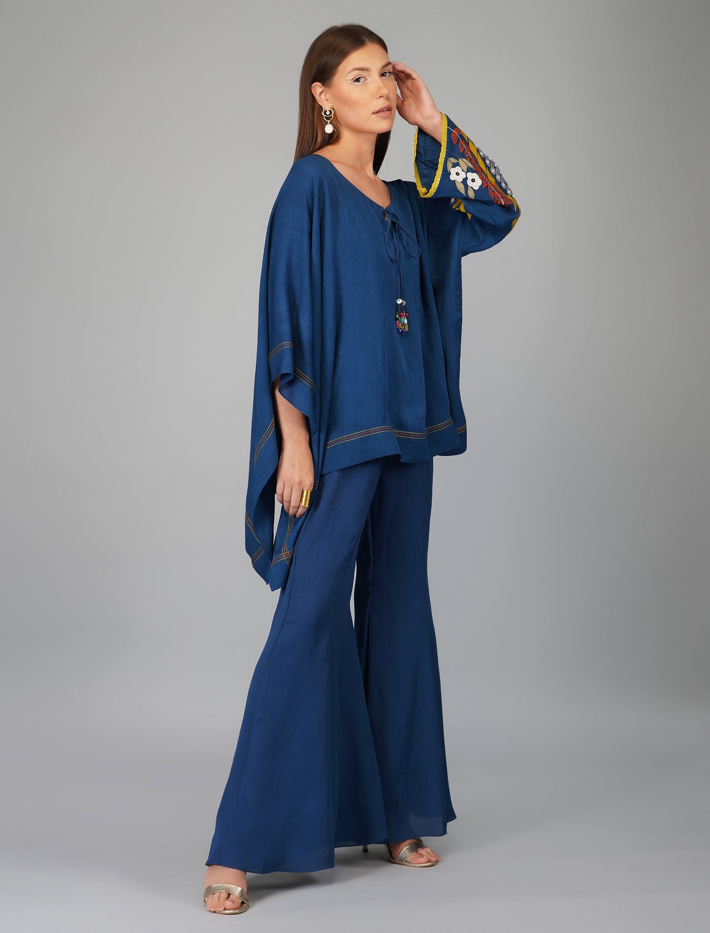 Blue Hand Embroidered Applique Cape Set at Kamakhyaa by Devyani Mehrotra. This item is Blue, Co-ord Sets, Embroidered, Evening Wear, Georgette, Natural, Patchwork, Pre Spring 2023, Relaxed Fit, Travel Co-ords, Viscose, Womenswear