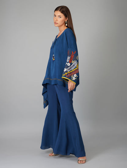 Blue Hand Embroidered Applique Cape Set at Kamakhyaa by Devyani Mehrotra. This item is Blue, Co-ord Sets, Embroidered, Evening Wear, Georgette, Natural, Patchwork, Pre Spring 2023, Relaxed Fit, Travel Co-ords, Viscose, Womenswear