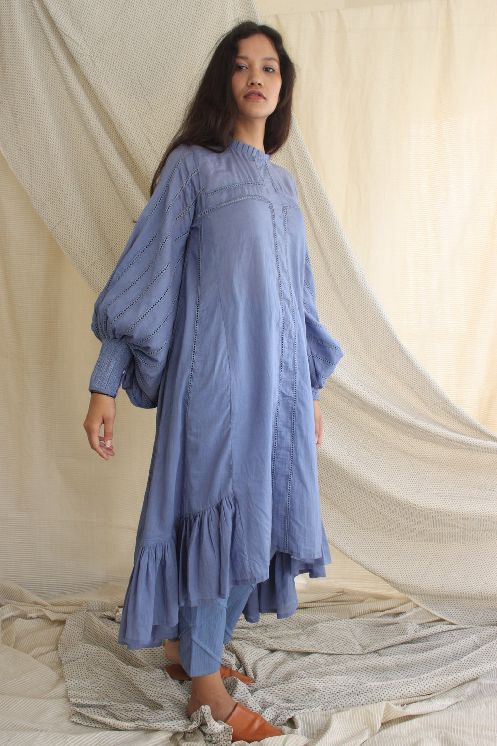 Blue Ruffle Full Sleeves Dress at Kamakhyaa by Chambray & Co.. This item is Blue, Casual Wear, Cotton, Midi Dresses, Natural, Regular Fit, Ruffle Dresses, Solids, Tiered Dresses, Womenswear