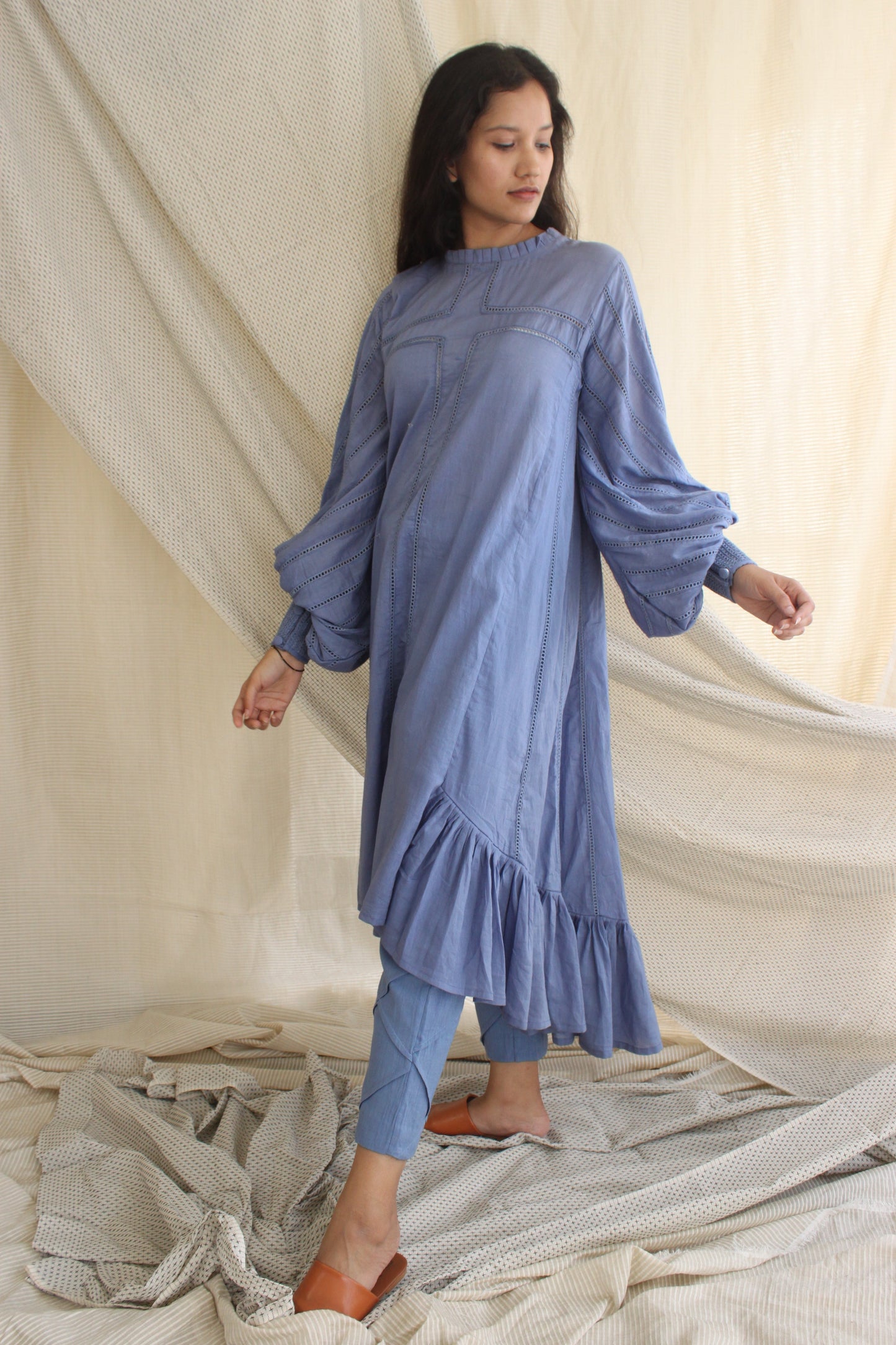 Blue Ruffle Full Sleeves Dress at Kamakhyaa by Chambray & Co.. This item is Blue, Casual Wear, Cotton, Midi Dresses, Natural, Regular Fit, Ruffle Dresses, Solids, Tiered Dresses, Womenswear
