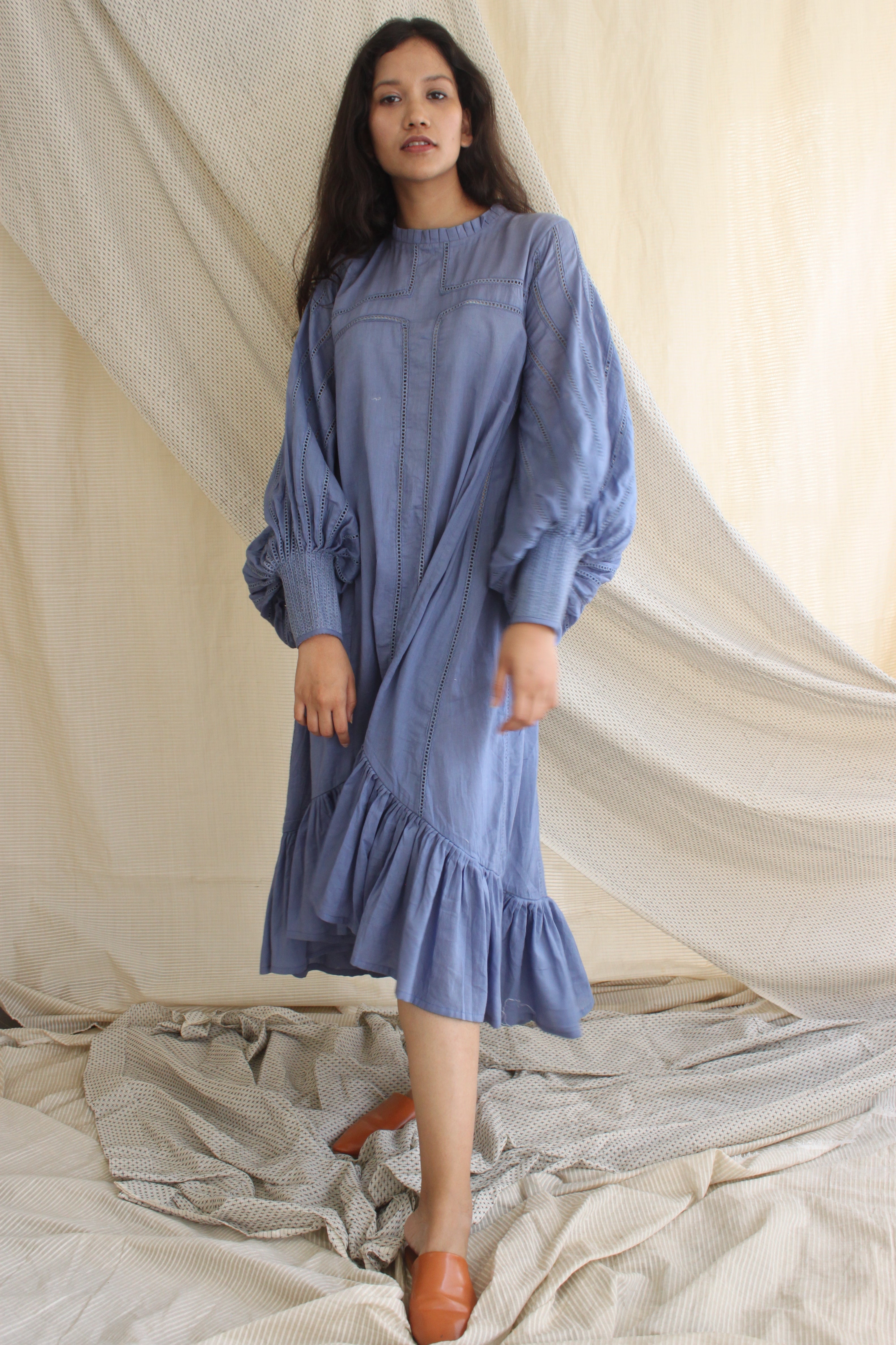 Blue Ruffle Full Sleeves Dress at Kamakhyaa by Chambray & Co.. This item is Blue, Casual Wear, Cotton, Midi Dresses, Natural, Regular Fit, Ruffle Dresses, Solids, Tiered Dresses, Womenswear