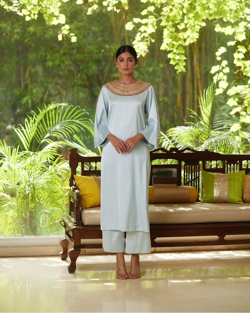 Blue Satin Silk Kurta Pant Set at Kamakhyaa by Mayura Kumar. This item is Blue, Casual Wear, Festive Wear, Kurta Pant Sets, Mayura Kumar, Regular Fit, Satin, Silk, Solids, Timeless Elegance, Womenswear