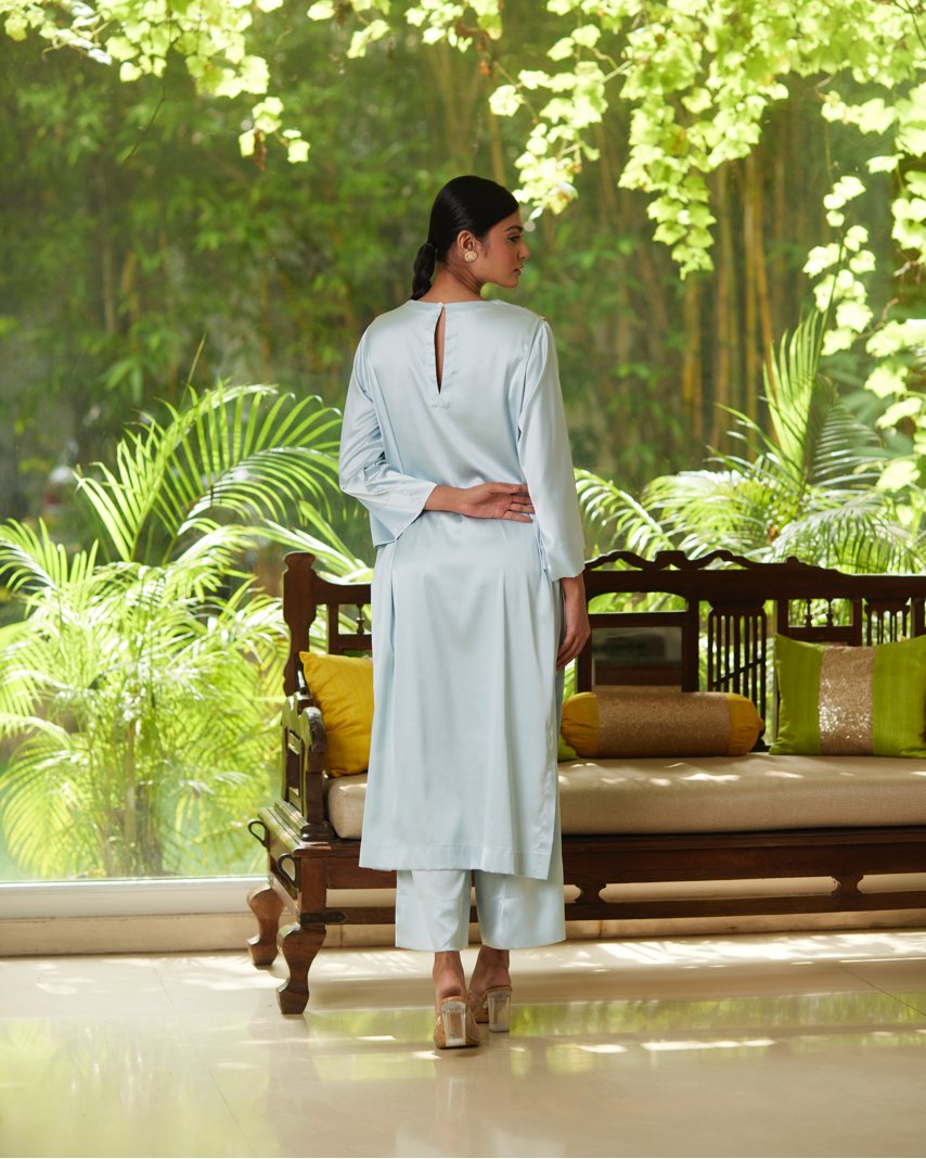 Blue Satin Silk Kurta Pant Set at Kamakhyaa by Mayura Kumar. This item is Blue, Casual Wear, Festive Wear, Kurta Pant Sets, Mayura Kumar, Regular Fit, Satin, Silk, Solids, Timeless Elegance, Womenswear