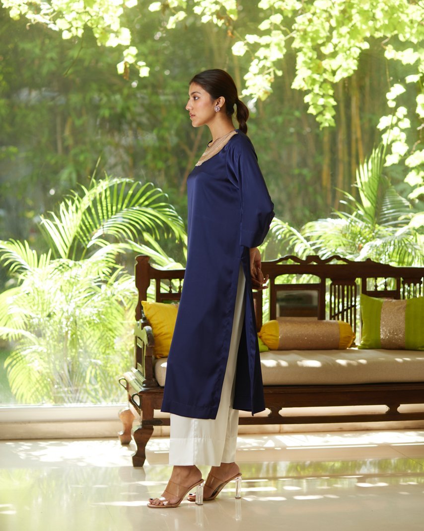 Blue Satin Silk Kurta Set at Kamakhyaa by Mayura Kumar. This item is Blue, Casual Wear, Festive Wear, Kurta Pant Sets, Mayura Kumar, Regular Fit, Satin, Silk, Solids, Timeless Elegance, Womenswear