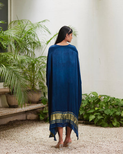 Blue Silk Kaftan With Golden Border at Kamakhyaa by Mayura Kumar. This item is Ajrakh Heritage, Blue, Casual Wear, Dresses, Festive Wear, Kaftans, Mayura Kumar, Modal Silk, Relaxed Fit, Solids, Womenswear