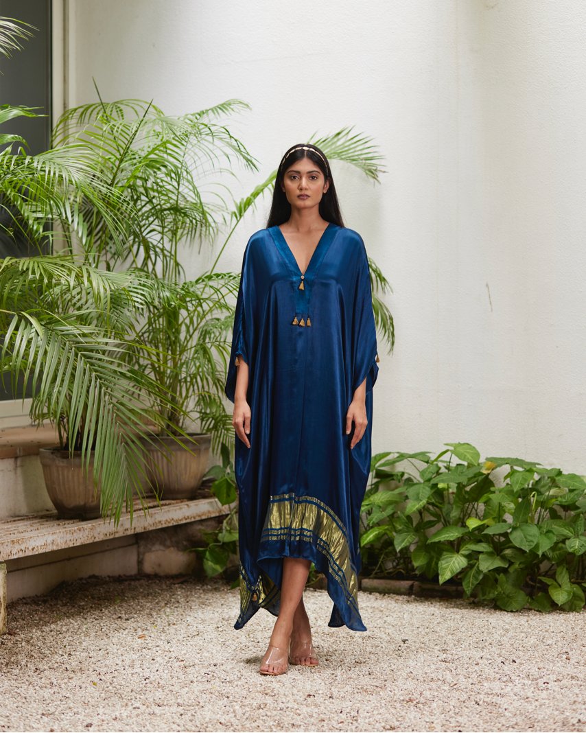 Blue Silk Kaftan With Golden Border at Kamakhyaa by Mayura Kumar. This item is Ajrakh Heritage, Blue, Casual Wear, Dresses, Festive Wear, Kaftans, Mayura Kumar, Modal Silk, Relaxed Fit, Solids, Womenswear