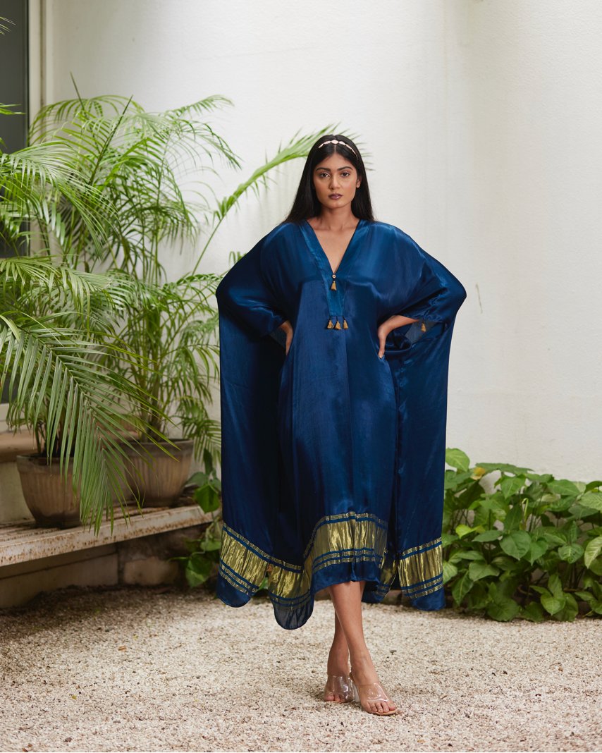 Blue Silk Kaftan With Golden Border at Kamakhyaa by Mayura Kumar. This item is Ajrakh Heritage, Blue, Casual Wear, Dresses, Festive Wear, Kaftans, Mayura Kumar, Modal Silk, Relaxed Fit, Solids, Womenswear