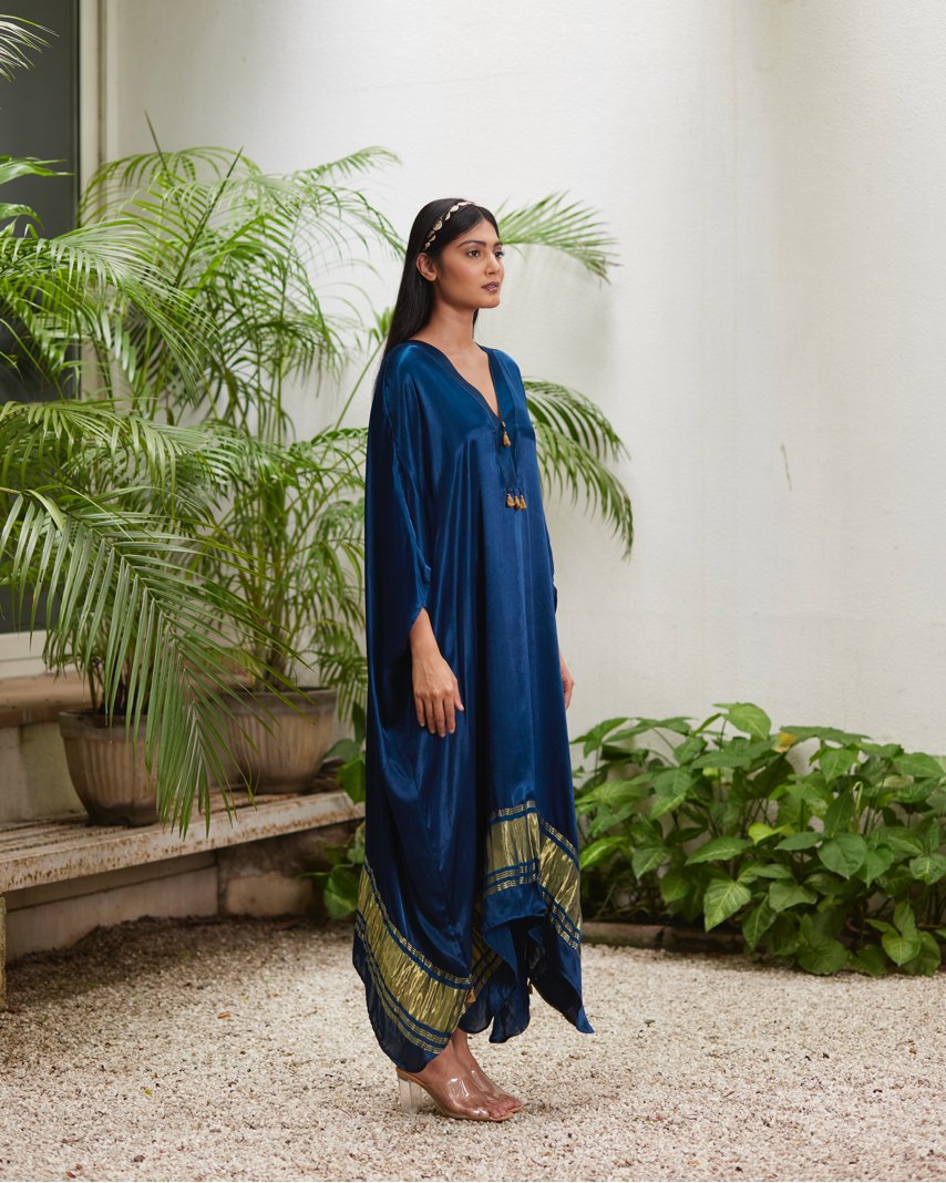 Blue Silk Kaftan With Golden Border at Kamakhyaa by Mayura Kumar. This item is Ajrakh Heritage, Blue, Casual Wear, Dresses, Festive Wear, Kaftans, Mayura Kumar, Modal Silk, Relaxed Fit, Solids, Womenswear