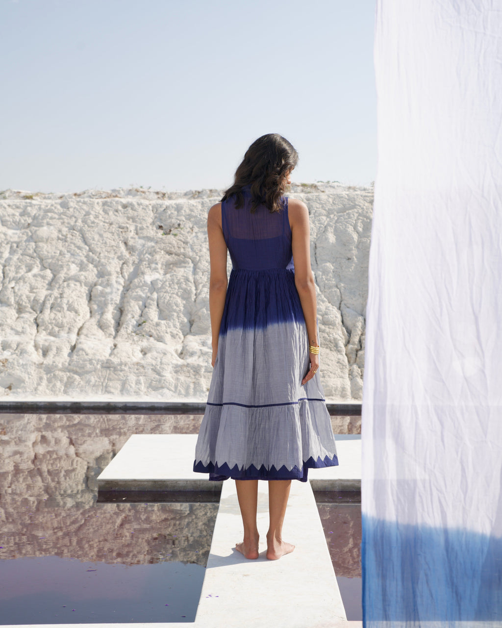 Blue Silk Midi Dress at Kamakhyaa by The Loom Art. This item is Aurora SS24, Best Selling, Blue, Casual Wear, Chanderi Silk, FB ADS JUNE, July Sale, July Sale 2023, Midi Dresses, Ombre & Dyes, Organic, Regular Fit, Sleeveless Dresses, Tiered Dresses, Womenswear