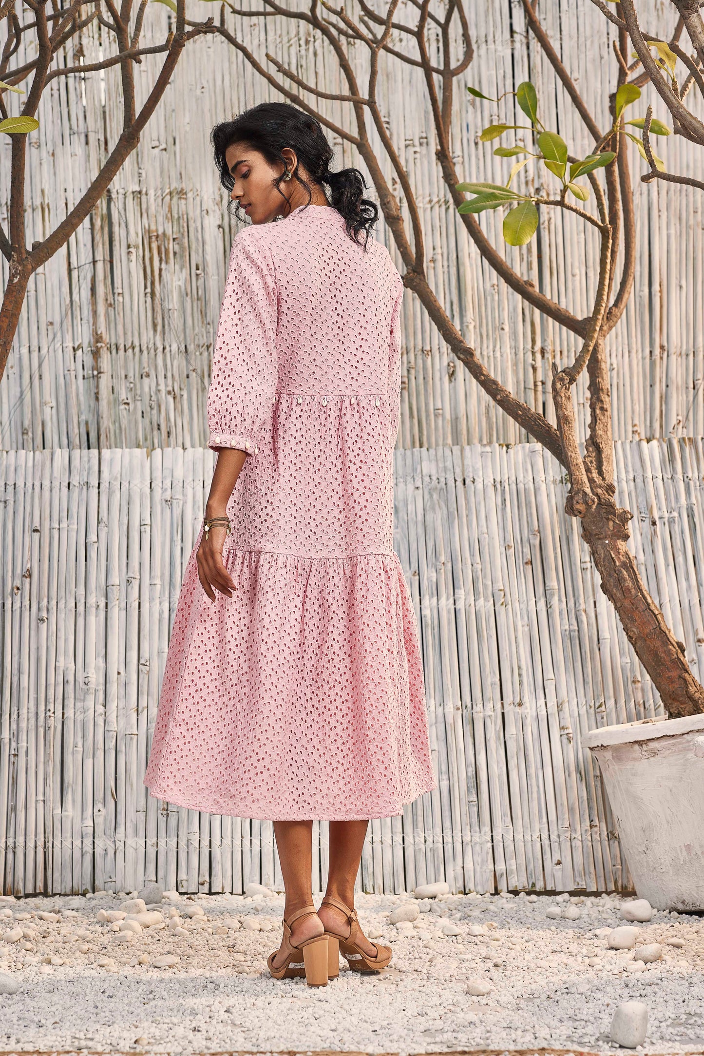 Breezy Cotton Cutwork Dress in Blush Pink at Kamakhyaa by Charkhee. This item is Cotton, Cutwork, Kurtas, Midi Dresses, Natural, Pink, Regular Fit, Resort Wear, Schiffli, Shores 23, Textured, Tiered Dresses, Womenswear