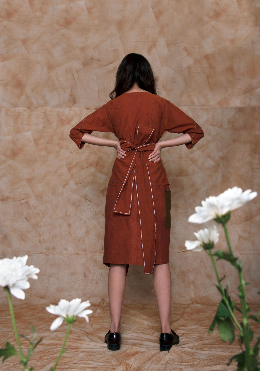 Brown Midi Skirt at Kamakhyaa by Anushé Pirani. This item is Brown, fall, Handwoven Cotton, July Sale, July Sale 2023, Mini Skirts, Natural, Ocean of Stories, Office Wear, Regular Fit, sale anushe pirani, Skirts, Solids, Womenswear