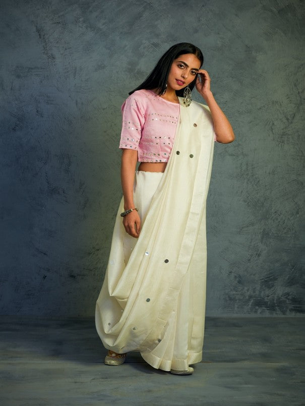 Chanderi Off-white Saree With Light Pink Blouse at Kamakhyaa by Charkhee. This item is Chanderi, Cotton, Embellished, Ethnic Wear, Indian Wear, Mirror Work, Natural, Pink, Relaxed Fit, Saree Sets, Tyohaar, White, Womenswear